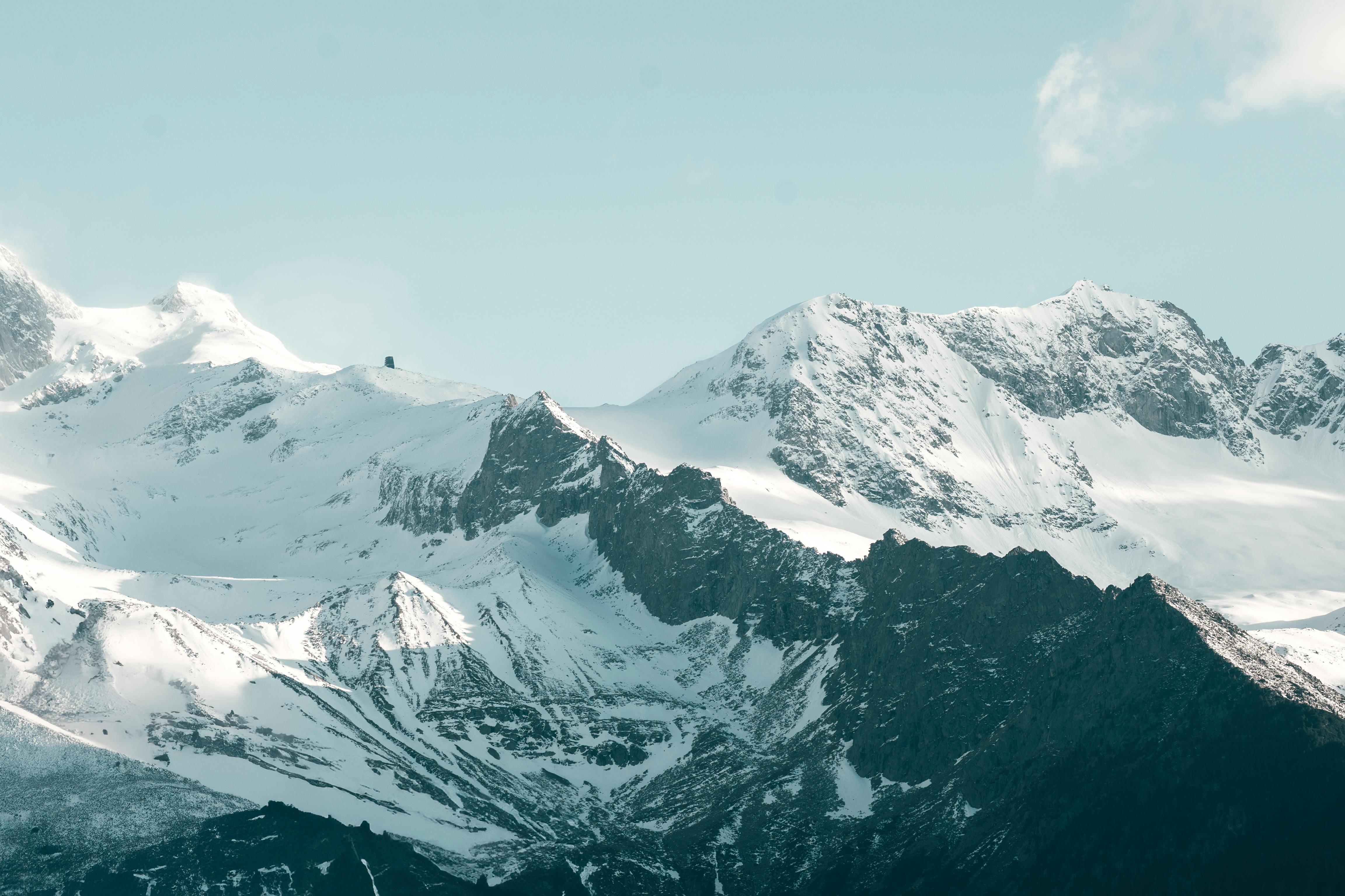 A picturesque village nestled in the Swiss Alps, covered in snow